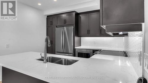 402 - 1975 Fountain Grass Drive, London, ON - Indoor Photo Showing Kitchen With Double Sink With Upgraded Kitchen