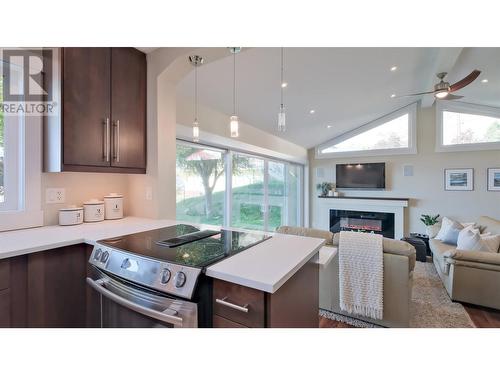 7005 Indian Rock Road Unit# 6, Naramata, BC - Indoor Photo Showing Kitchen With Fireplace