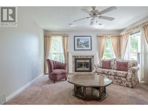 1108 14 Avenue Unit# 134, Vernon, BC - Indoor Photo Showing Living Room With Fireplace