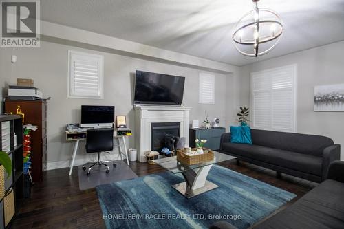 Upper - 1904 Cheesewright Court, Oshawa, ON - Indoor Photo Showing Living Room With Fireplace