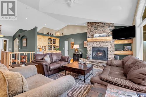 21 Mccrimmon Crescent, Blackstrap Shields, SK - Indoor Photo Showing Living Room With Fireplace