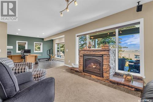 21 Mccrimmon Crescent, Blackstrap Shields, SK - Indoor Photo Showing Living Room With Fireplace