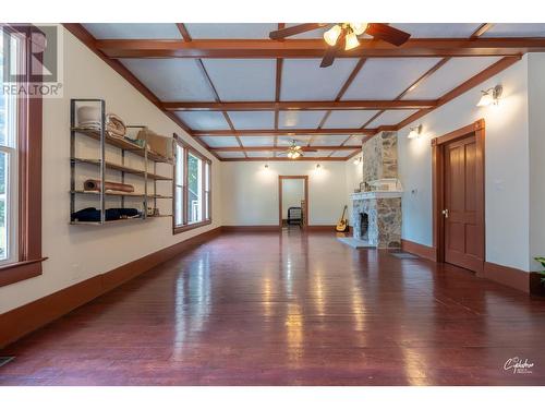 7585 5Th Street, Grand Forks, BC - Indoor Photo Showing Other Room With Fireplace