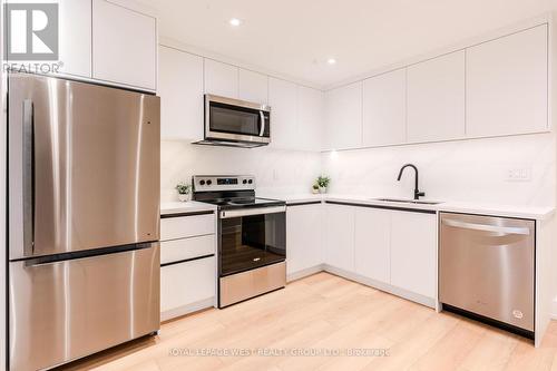 Lower - 90 Eleventh Street, Toronto, ON - Indoor Photo Showing Kitchen With Upgraded Kitchen