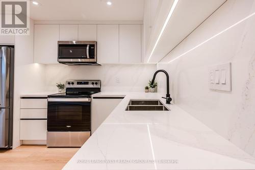 Lower - 90 Eleventh Street, Toronto, ON - Indoor Photo Showing Kitchen With Double Sink With Upgraded Kitchen