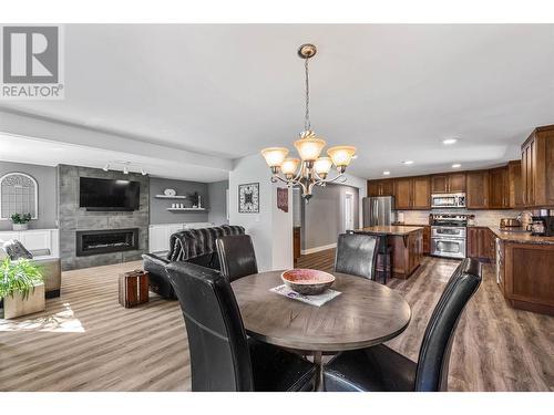 8661 Skimikin Road, Chase, BC - Indoor Photo Showing Dining Room With Fireplace