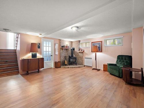 Basement - 223 Rue Lavoie, Sainte-Thérèse, QC - Indoor Photo Showing Living Room With Fireplace