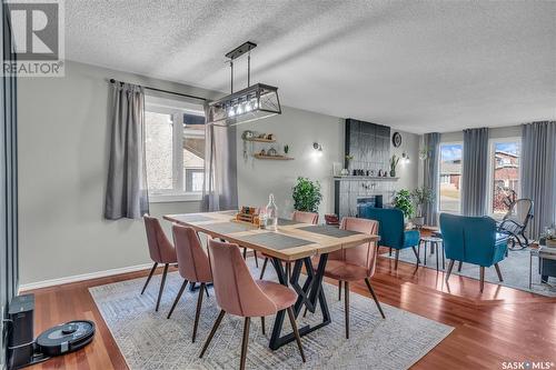 3230 Tufts Bay E, Regina, SK - Indoor Photo Showing Other Room With Fireplace