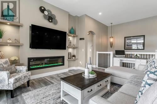 1077 Loseth Drive, Kelowna, BC - Indoor Photo Showing Living Room With Fireplace