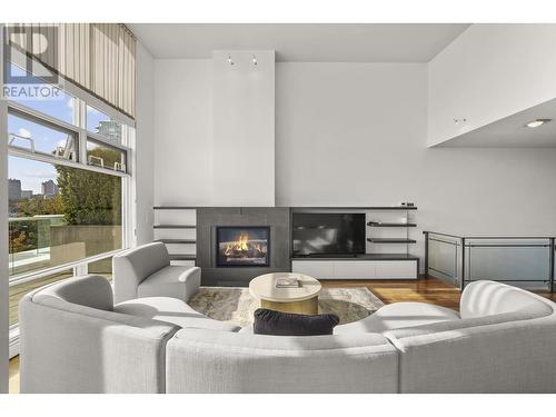 Th K 1111 Marinaside Crescent, Vancouver, BC - Indoor Photo Showing Living Room With Fireplace