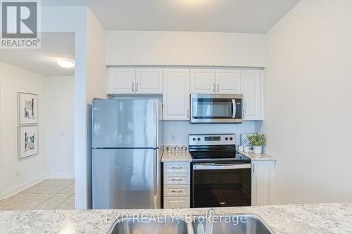 519 - 16 Concord Place, Grimsby, ON - Indoor Photo Showing Kitchen With Double Sink