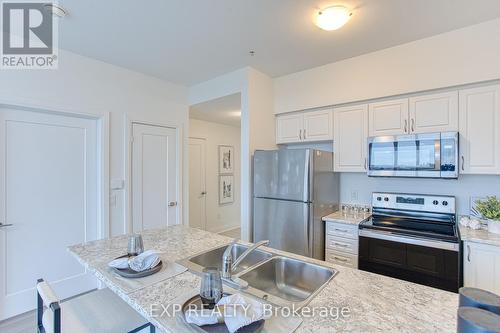 519 - 16 Concord Place, Grimsby, ON - Indoor Photo Showing Kitchen With Double Sink