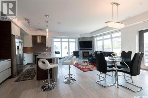 302 922 Broadway Avenue, Saskatoon, SK - Indoor Photo Showing Other Room With Fireplace