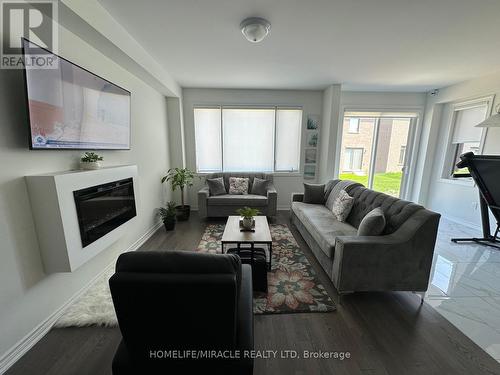 41 Spinland Street, Caledon, ON - Indoor Photo Showing Living Room With Fireplace