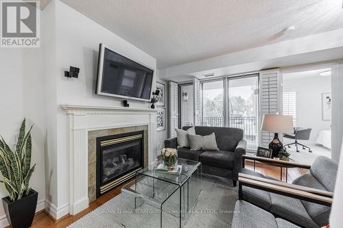 207 - 2 Alexandra Boulevard W, Toronto, ON - Indoor Photo Showing Living Room With Fireplace