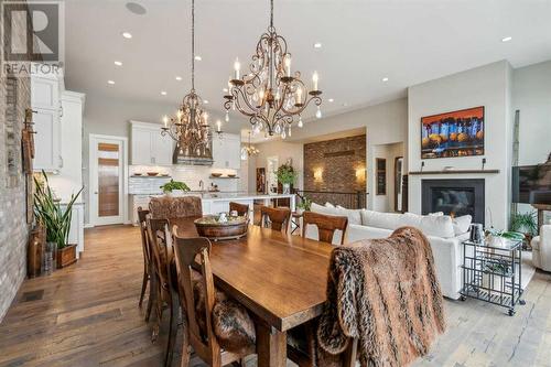 468 Auburn Shores Landing Se, Calgary, AB - Indoor Photo Showing Dining Room With Fireplace