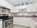 209-290 Island Hwy, View Royal, BC  - Indoor Photo Showing Kitchen With Double Sink 