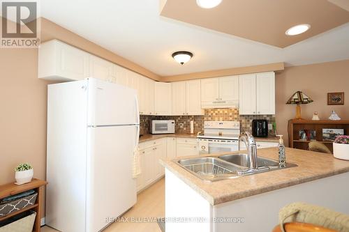 266 Pebble Beach Parkway, South Huron (Stephen Twp), ON - Indoor Photo Showing Kitchen With Double Sink