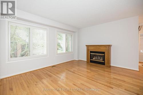 9 Briarwood Drive, New Tecumseth, ON - Indoor Photo Showing Living Room With Fireplace