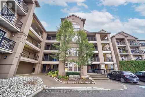 406 - 1350 Main Street E, Milton, ON - Outdoor With Balcony With Facade