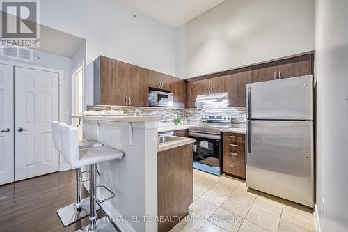 406 - 1350 Main Street E, Milton, ON - Indoor Photo Showing Kitchen With Double Sink