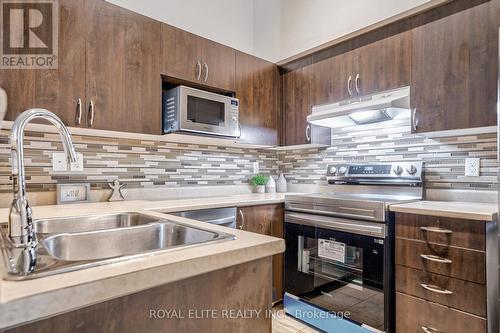 406 - 1350 Main Street E, Milton, ON - Indoor Photo Showing Kitchen With Double Sink With Upgraded Kitchen