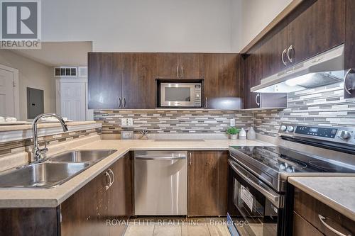 406 - 1350 Main Street E, Milton, ON - Indoor Photo Showing Kitchen With Double Sink With Upgraded Kitchen