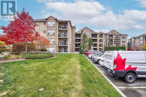 406 - 1350 Main Street E, Milton, ON - Outdoor With Balcony With Facade