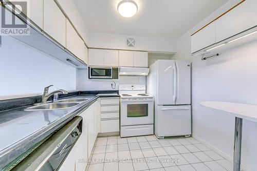 702 - 50 Kingsbridge Gardens, Mississauga, ON - Indoor Photo Showing Kitchen With Double Sink