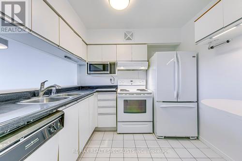 702 - 50 Kingsbridge Gardens, Mississauga, ON - Indoor Photo Showing Kitchen With Double Sink