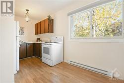 Kitchen enjoys lots of natural light. - 