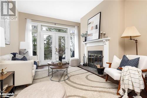 311 Grandview Hilltop Drive Unit# 3, Huntsville, ON - Indoor Photo Showing Living Room With Fireplace