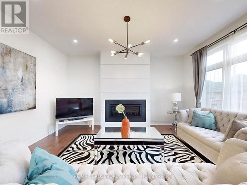 68 Kentledge Avenue, East Gwillimbury, ON - Indoor Photo Showing Living Room With Fireplace