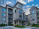 110 - 1440 Main Street E, Milton, ON  - Outdoor With Balcony With Facade 