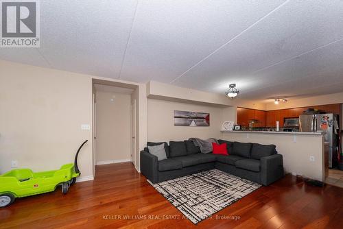 110 - 1440 Main Street E, Milton, ON - Indoor Photo Showing Living Room