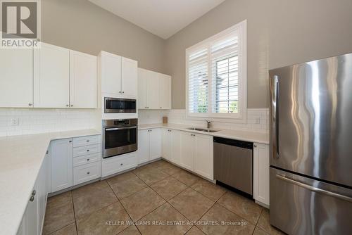 110 - 1440 Main Street E, Milton, ON - Indoor Photo Showing Kitchen With Stainless Steel Kitchen With Double Sink