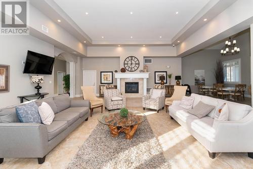 110 - 1440 Main Street E, Milton, ON - Indoor Photo Showing Living Room With Fireplace