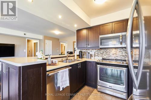 301 - 1725 Pure Springs Boulevard N, Pickering, ON - Indoor Photo Showing Kitchen With Stainless Steel Kitchen With Double Sink With Upgraded Kitchen