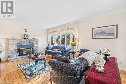 240 Somerset Drive, Loyalist (Bath), ON - Indoor Photo Showing Living Room With Fireplace