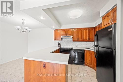 208 - 120 Barrett Court, Kingston (Kingston East (Incl Barret Crt)), ON - Indoor Photo Showing Kitchen With Double Sink