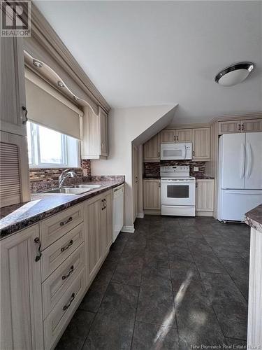 95 Landsdowne Street, Campbellton, NB - Indoor Photo Showing Kitchen With Double Sink