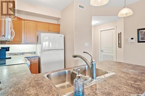 204 102 Armistice Way, Saskatoon, SK - Indoor Photo Showing Kitchen With Double Sink