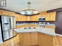 102 586 River Street E, Prince Albert, SK  - Indoor Photo Showing Kitchen With Stainless Steel Kitchen With Double Sink 