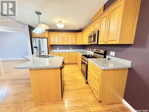 102 586 River Street E, Prince Albert, SK - Indoor Photo Showing Kitchen With Double Sink