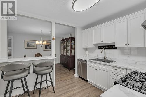 645 Barrera Road Unit# 204, Kelowna, BC - Indoor Photo Showing Kitchen With Double Sink