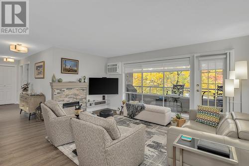 645 Barrera Road Unit# 204, Kelowna, BC - Indoor Photo Showing Living Room With Fireplace