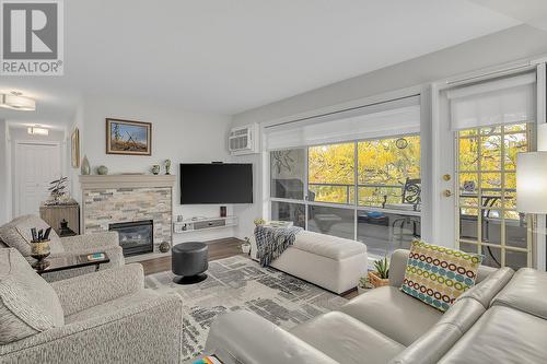 645 Barrera Road Unit# 204, Kelowna, BC - Indoor Photo Showing Living Room With Fireplace