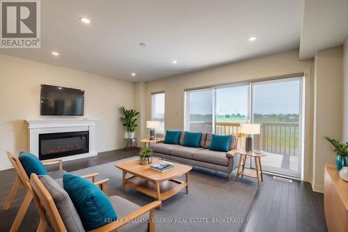 144 Sailors Landing, Clarington (Bowmanville), ON - Indoor Photo Showing Living Room With Fireplace