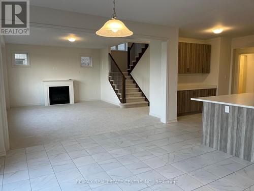 260 Rea Drive, Centre Wellington, ON - Indoor Photo Showing Other Room With Fireplace