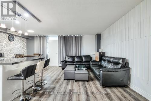 402 - 1950 Kennedy Road, Toronto, ON - Indoor Photo Showing Living Room